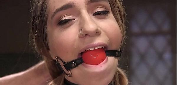Gagged slave rides vibrator on a stick